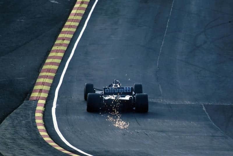 The Brabham BT54 sparks through Paddock Hill.