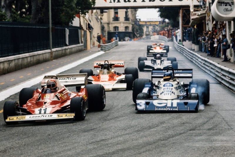 Niki Lauda (Ferrari) fights with Ronnie Peterson Tyrrell at the 1977 Monaco Grand Prix.