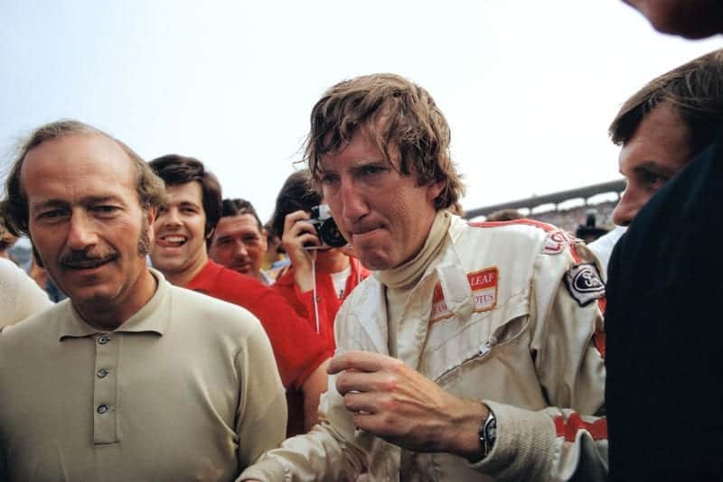 Jochen Rindt is congratulated by Lotus team boss Colin Chapman after winning the German Grand Prix.