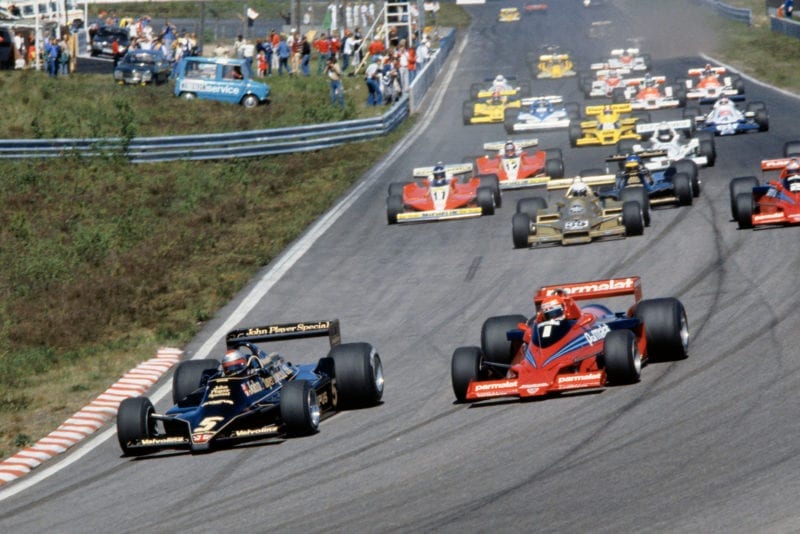 Mario Andretti (Lotus) fends off Niki Lauda (Brabham) at the start of the 1978 Swedish Grand Prix, Anderstorp.