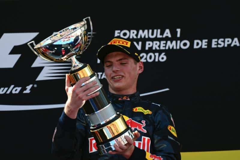 Max Verstappen holds the first-place trophy