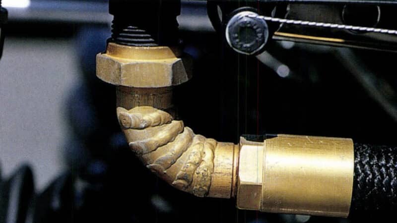 Curved pipe attached to Tyrrell 001 oil cooler