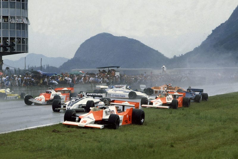 Chaos at the start with Andrea de Cesaris (#8 McLaren M29F-Ford Cosworth), Hector Rebaque (#6 Brabham BT49C-Ford Cosworth), Mario Andretti (#22 Alfa Romeo 179C), Rene Arnoux (#16 Renault RE20), John Watson (#7 McLaren M29F-Ford Cosworth), Chico Serra (#21 Fittipaldi F8C-Ford Cosworth), Ricardo Zunino (Tyrrell 010-Ford Cosworth), Siegfried Stohr (#30 Arrows A3-Ford Cosworth) and Jean-Pierre Jarier (Ligier JS17-Matra) are all involved in an accident on the grid.