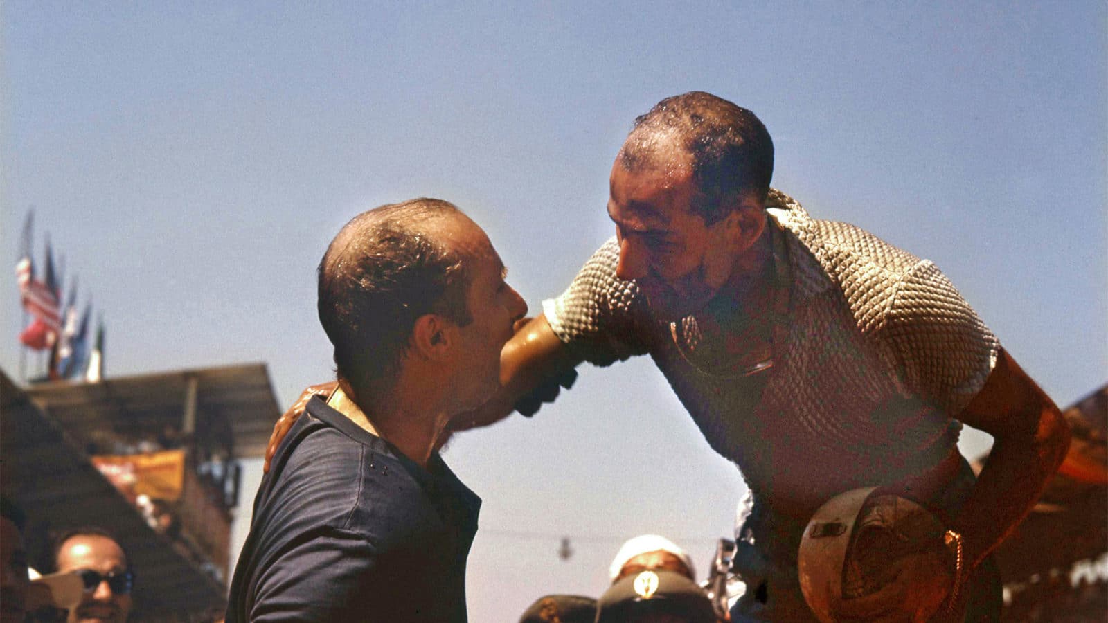 Stirling Moss Juan Manuel Fangio greet each other after a race