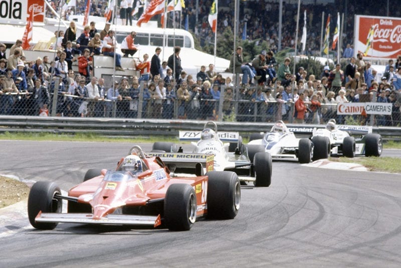 Didier Pironi (Ferrari 126C) leads Carlos Reutemann (Williams FW07C-Ford Cosworth), Nelson Piquet (Brabham BT49C-Ford Cosworth) and Alan Jones (Williams FW07C-Ford Cosworth).