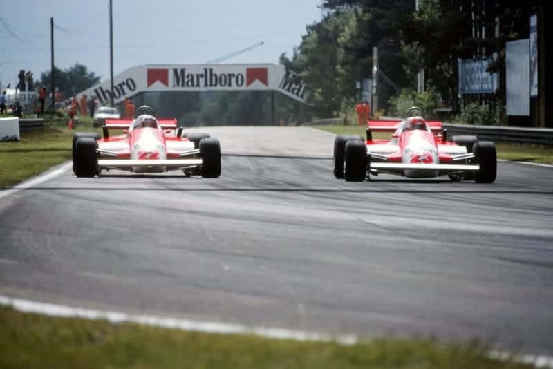 L-R: The Alfa Romeo's of Mario Andretti and Bruno Giacomelli.