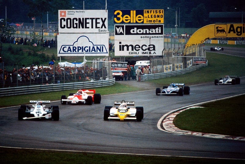 Alan Jones in a Williams FW07C (with a damaged front wing after contact with his team mate), is overtaken at Tosa by Rene Arnoux in his Renault RE20.