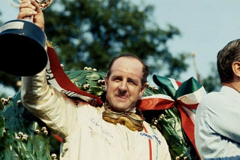 Denny Hulme (McLaren Ford) 1st position on the podium.