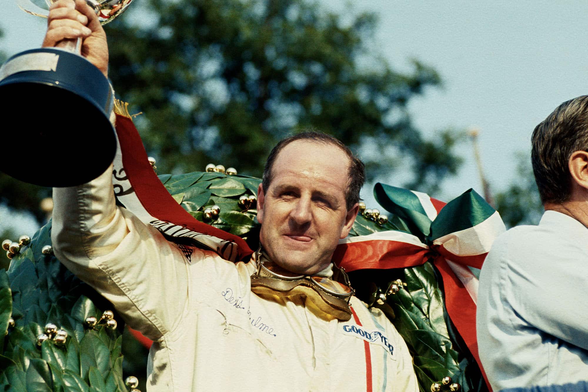 Denny Hulme (McLaren Ford) 1st position on the podium.
