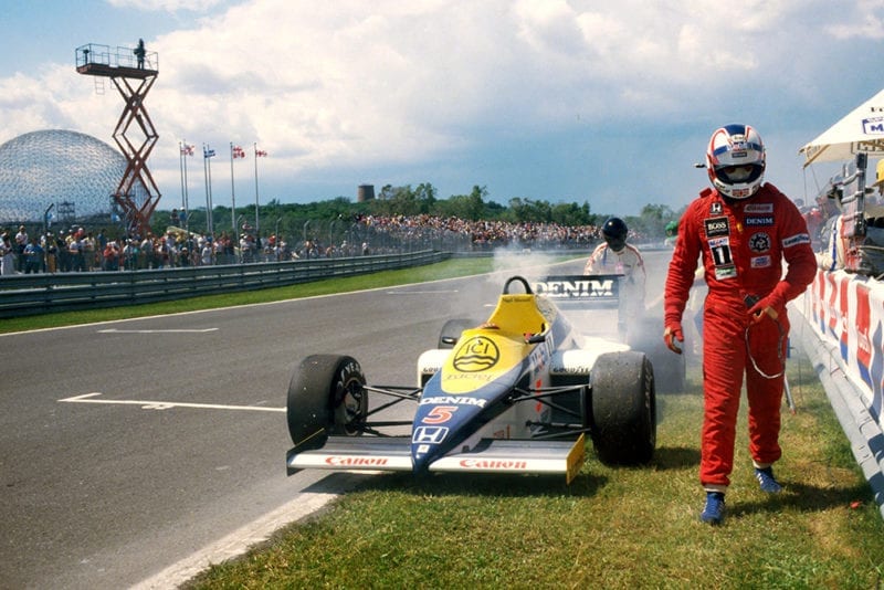 Nigel Mansell walks from his Williams FW10 during Saturday qualifying when he suffered a problem with a Honda turbo.