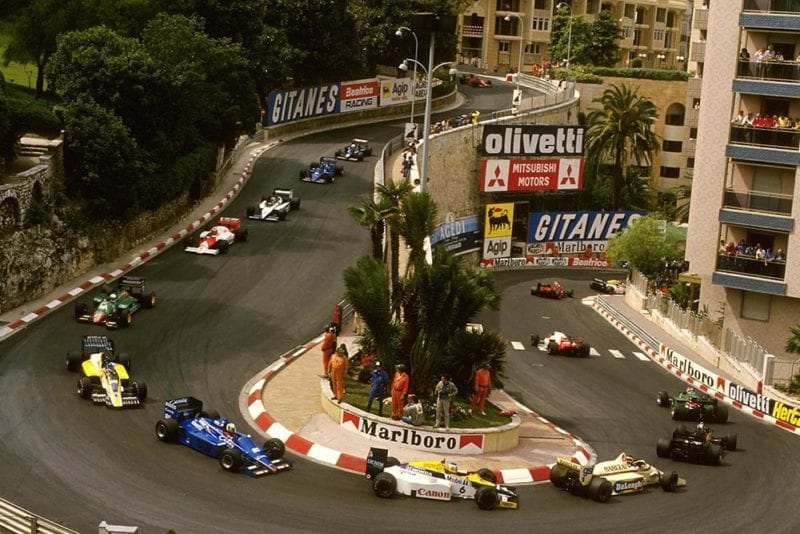 The cars make their way round the hairpin.