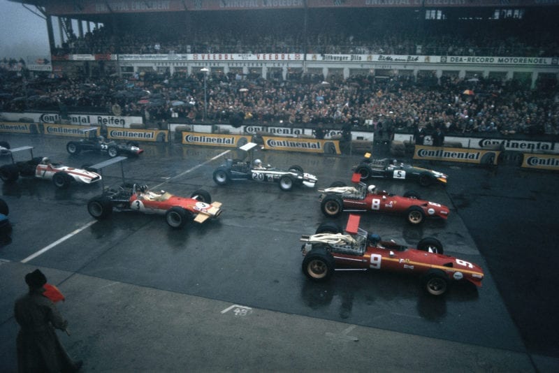 Jacky Ickx, Ferrari 312, leads the field away. Team mate Chris Amon, Jochen Rindt, Brabham BT26 Repco, Vic Elford, Cooper T86B BRM, and Graham Hill, Lotus 49B Ford, follow after.