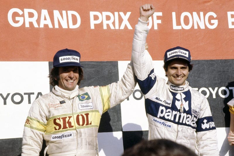 Nelson Piquet (Brabham BT49-Ford Cosworth), 1st position and Emerson Fittipaldi (Fittipaldi F7-Ford Cosworth), 3rd position on the podium.