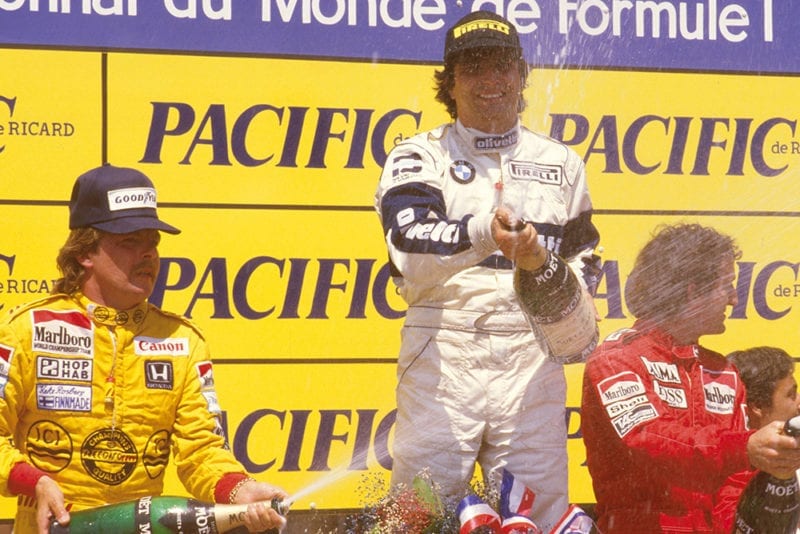 Nelson Piquet, 1st position, Keke Rosberg, 2nd position and Alain Prost, 3rd position on the podium.