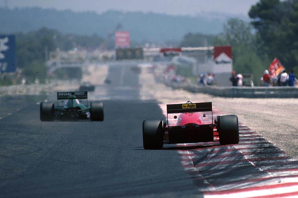 The cars head down the main straight.