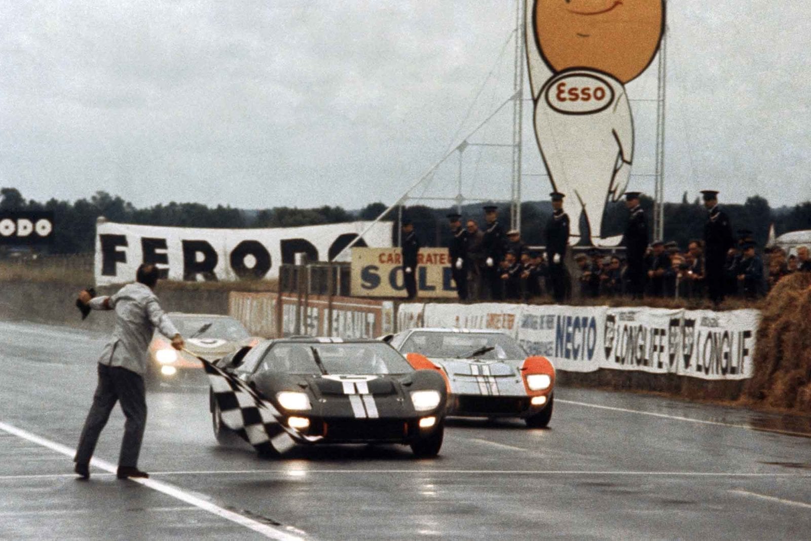 Bruce McLaren edges ahead of Ken Miles at the finish of the 1966 Le Mans 24 Hours, both in Ford GT40 MkII
