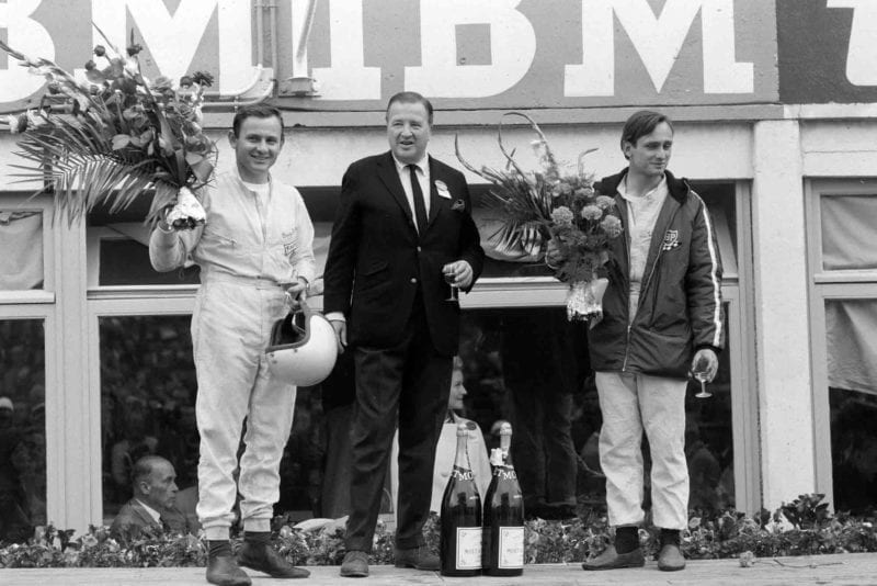 Henry Ford on the podium with his winning Gt40 MkII drivers Bruce McLaren and Chris Amon
