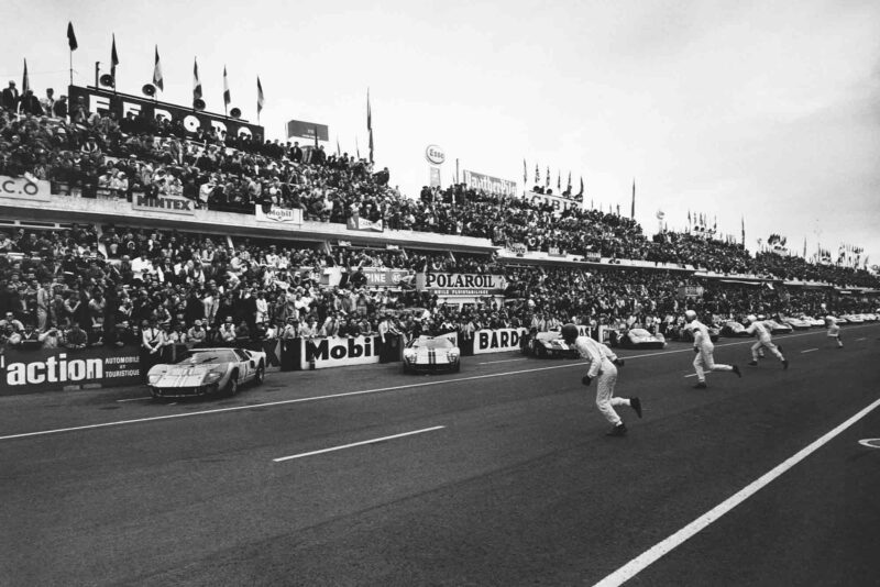 Drivers run to their cars at the start of Le Mans 1966