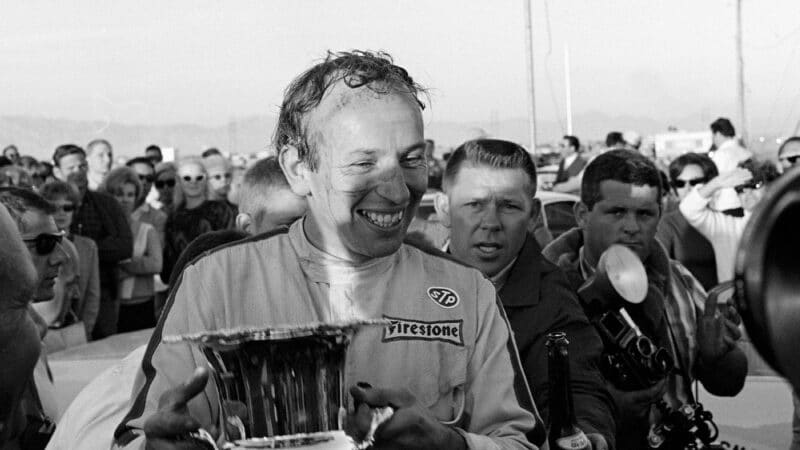 Joihn Surtees celebrates winning 1966 Can-Am series in Las Vegas with Lola T70