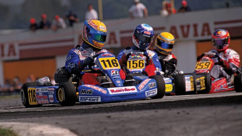 Colin Brown leads Clivio Piccione and Lewis Hamilton in kart race