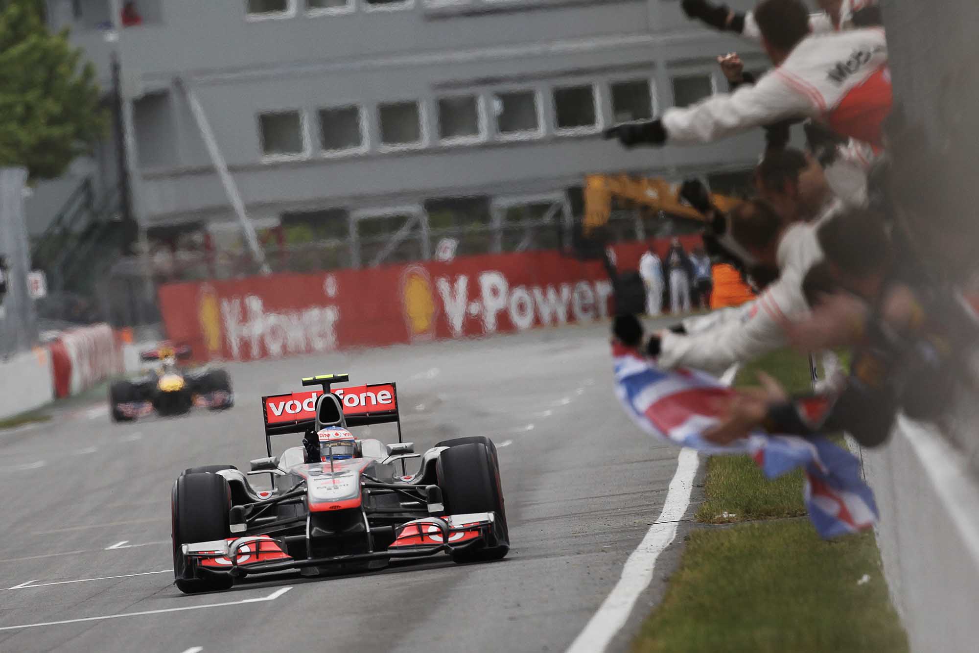 Jenson Button takes the chequered flag to win 2010 Canadian Grand Prix Montreal