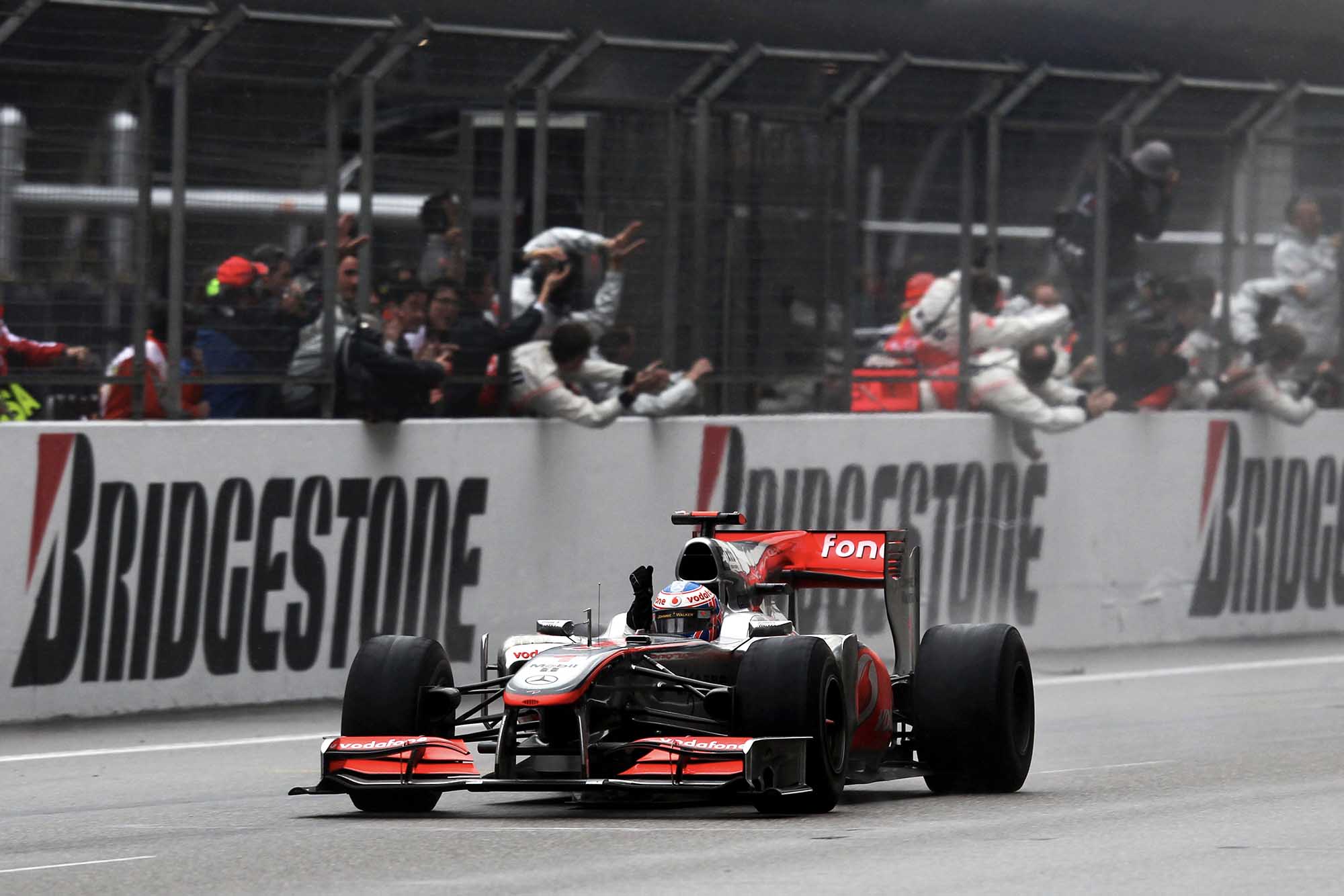 Jenson Button crosses the line for McLaren-Mercedes at 2010 Chinese Grand Prix Shanghai