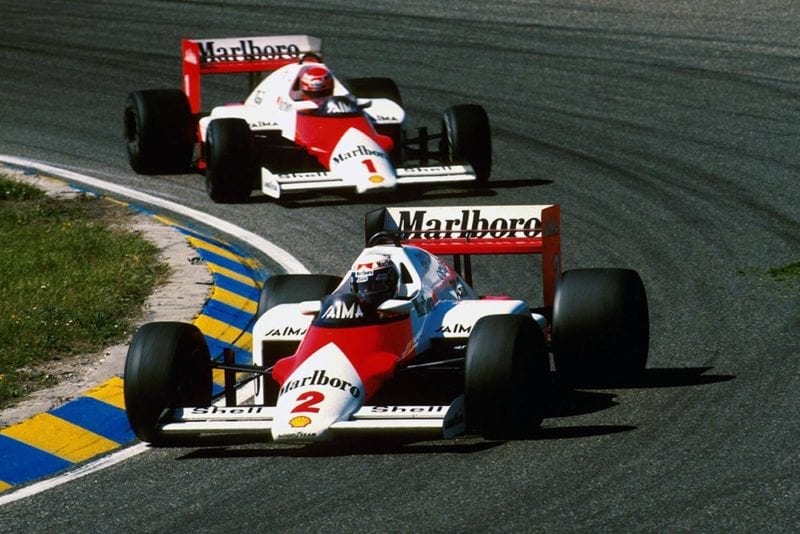 Alain Prost leads teammate Niki Lauda both in McLaren MP4/2B.