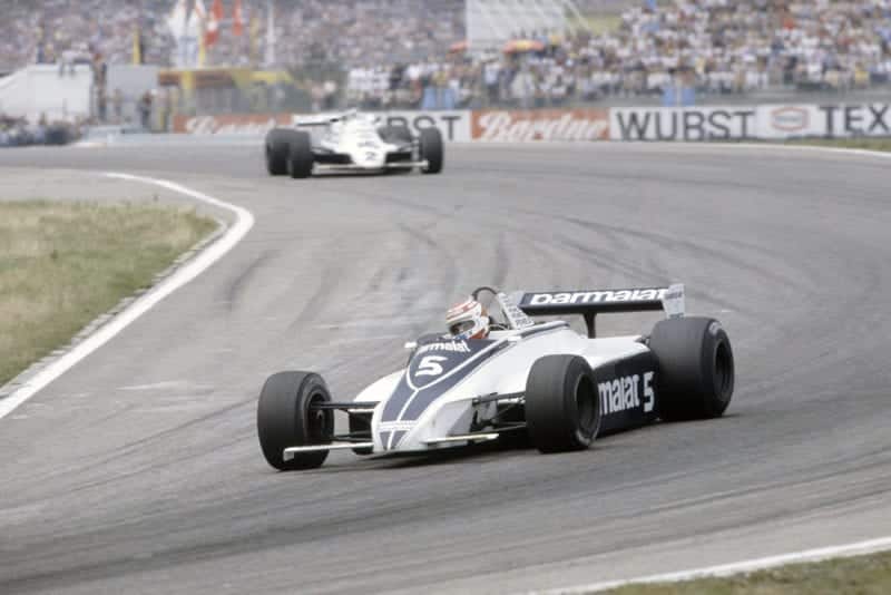 Nelson Piquet (Brabham BT49C-Ford Cosworth) leads Carlos Reutemann (Williams FW07C-Ford Cosworth).