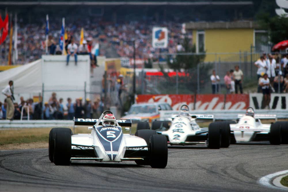 Race winner Nelson Piquet (Brabham BT49C), ahead of Carlos Reutemann (Williams FW07C).