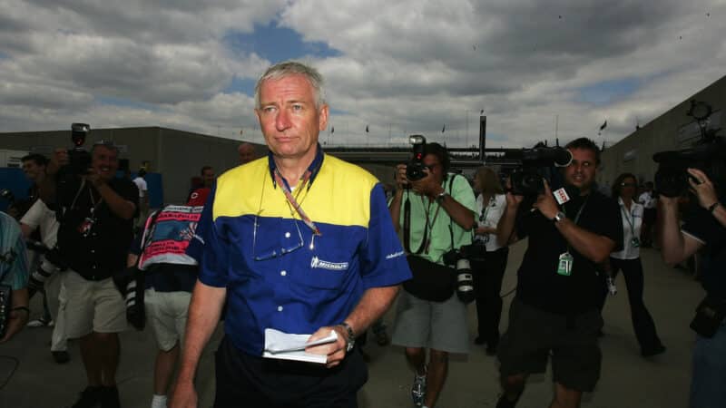 Michelin F1 boss Nick Sherrock walks through Indianapolis paddock at 2005 US Grand Prix