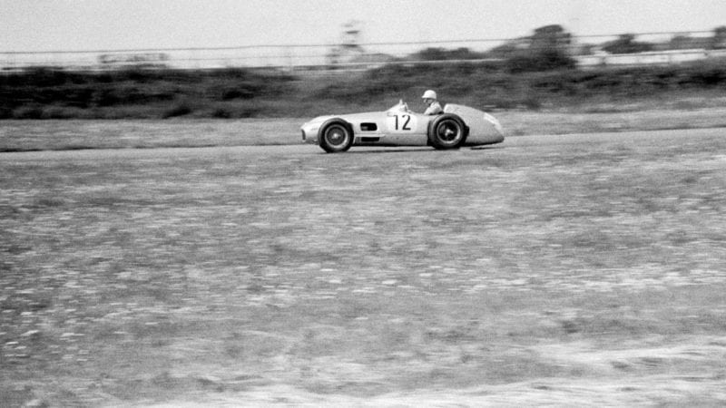 Side view of Stirling Moss during the 1955 F1 British Grand Prix at Aintree