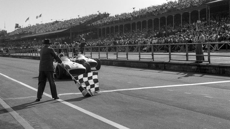 Stirling Moss, Juan Manuel Fangio, Grand Prix of Great Britain, Aintree, England, July 16, 1955. Stirling Moss wins the British Grand Prix ahead of Fangio. (Photo by Bernard Cahier/Getty Images)