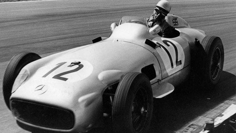 Stirling Moss during the 1955 British Grand Prix at Aintree