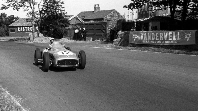 Stirling Moss in his Mercedes W196 R during the 1955 British Grand Prix at Aintree