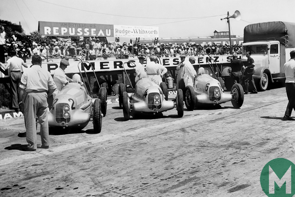 Mercedes line-up in 1935, with cars for Rudolf Caracciola, Manfred von Brauchitsch and Luigi Fagioli in the pits