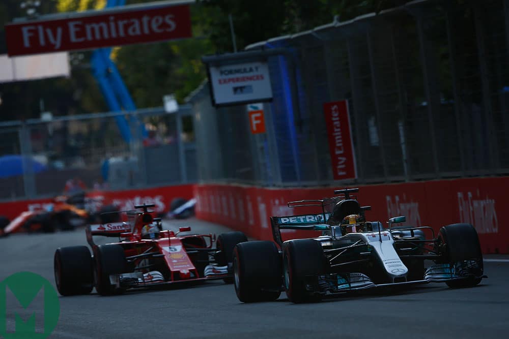 Sebastian Vettel Ferrari chases Lewis Hamilton Mercedes in the 2017 Azerbaijan GP