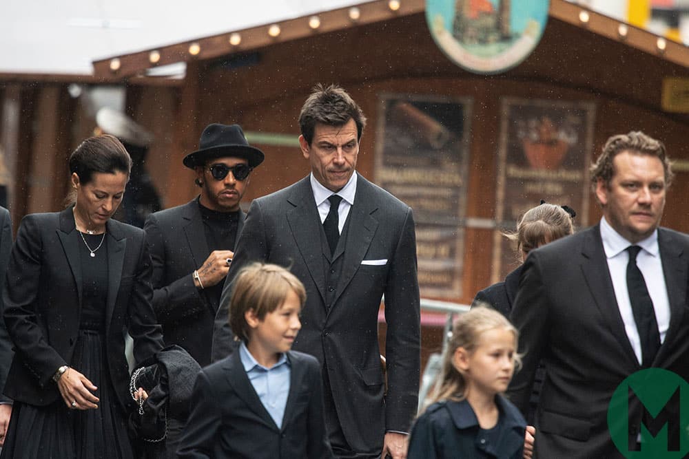 Toto Wolff with Niki Laudas wife Birgit and Lewis Hamilton at funeral