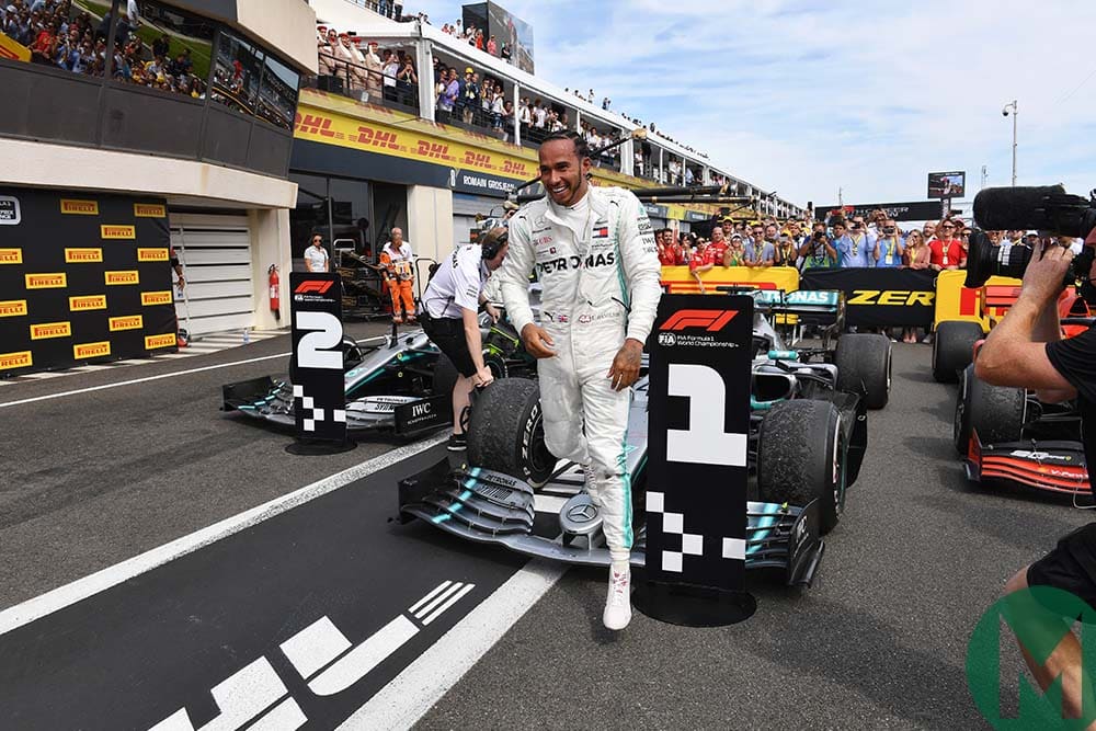 Lewis Hamilton steps from his car after winning the 2019 French Grand Prix
