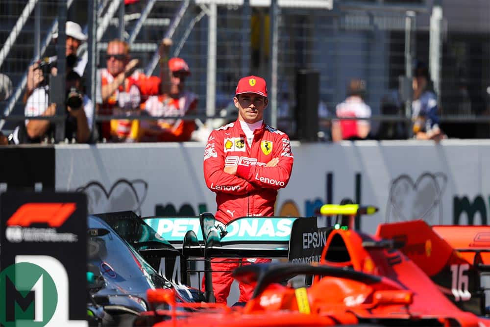 Charles Leclerc looks at his car parked in the No1 position after qualifying on pole for the 2019 Austrian Grand Prix