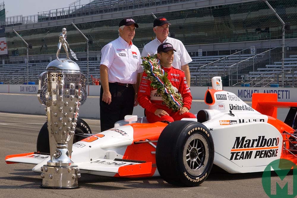 Gil de Ferran with his 2003 Indy 50-winning Penske and the race trophy