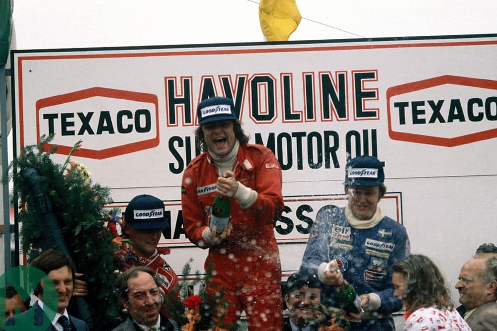 Gunnar Nilsson spraying champagne at the 1977 Belgian Grand Prix