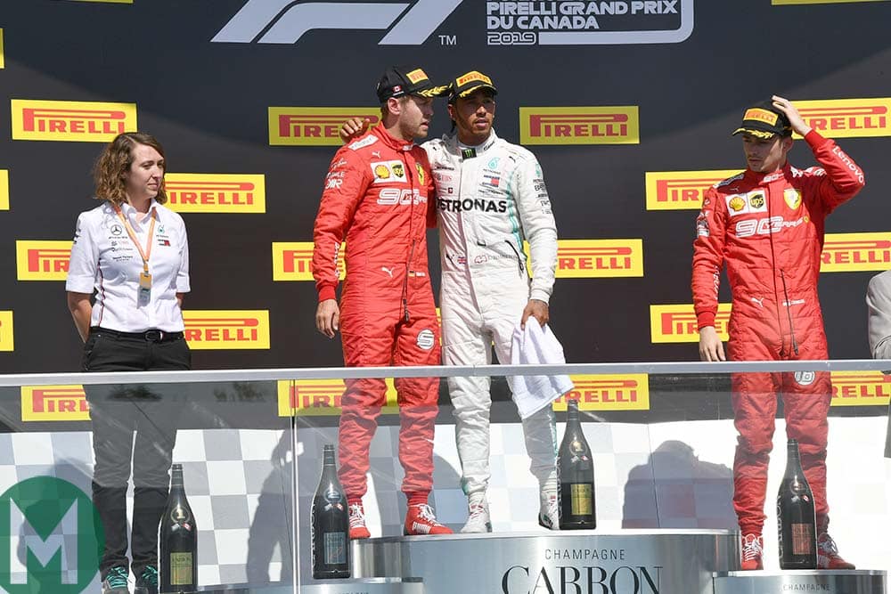 Lewis Hamilton invites Sebastian Vettel onto the top step of the podium after the 2019 Canadian Grand Prix