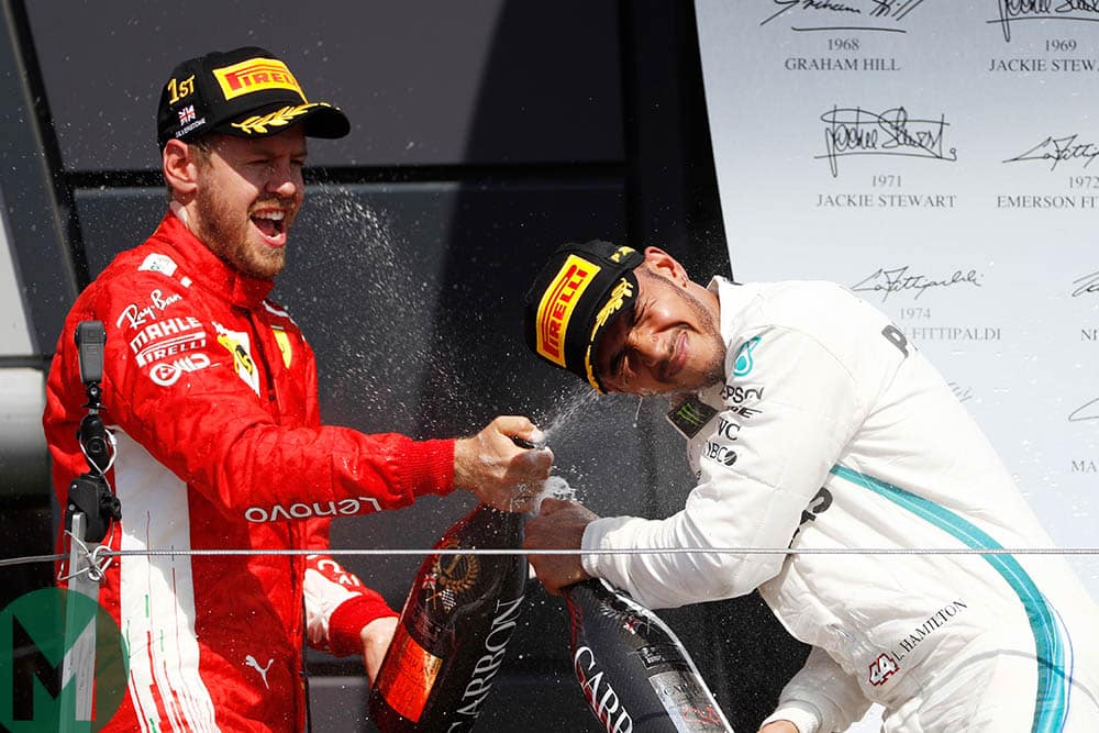 Lewis Hamilton and Sebastian Vettel spray champagne at the 2018 British Grand Prix