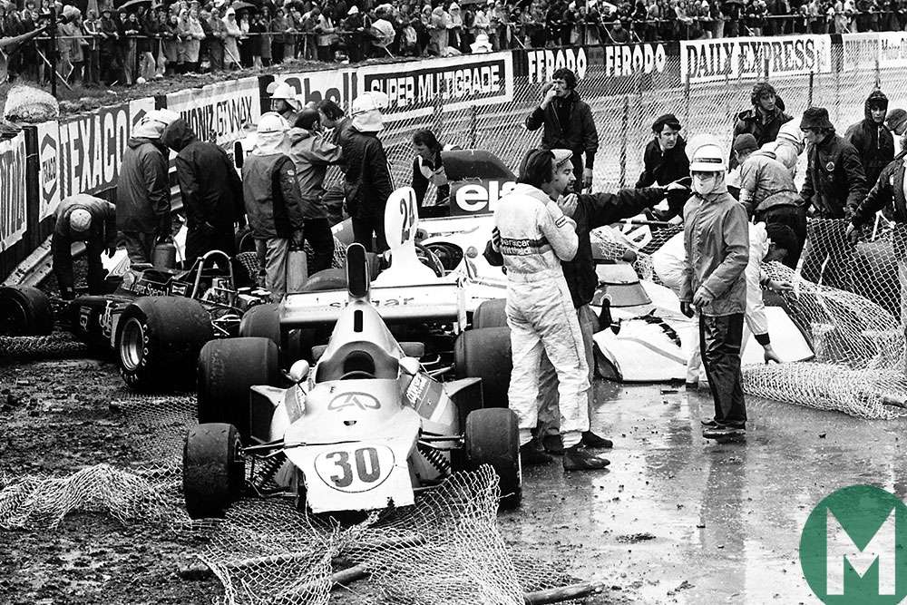Crashed cars pile up at Club corner late in the 1975 British Grand Prix