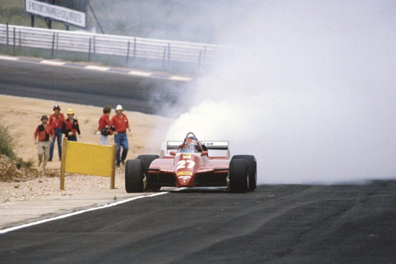 Gilles Villeneuve exits the race with a blown turbo in his Ferrari 126C2.