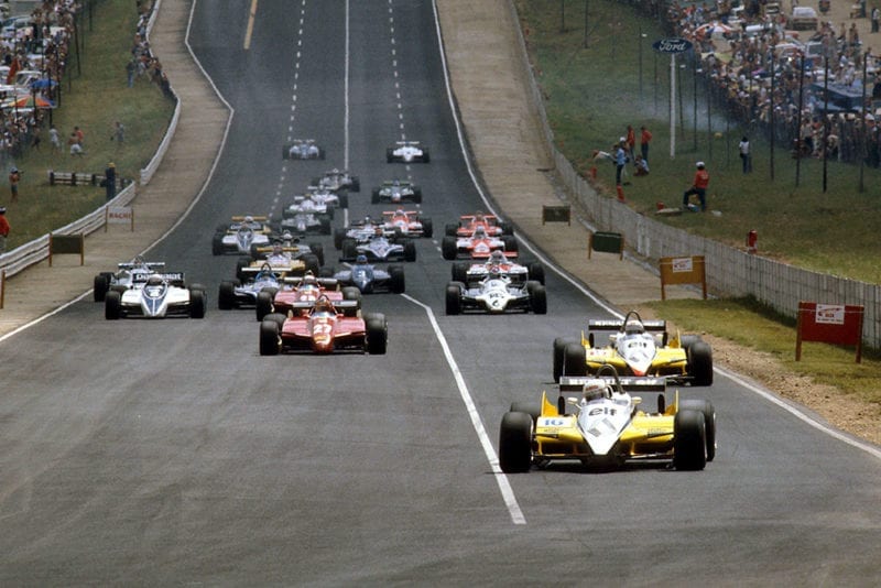 Rene Arnoux and teammate Alain Prost (both Renault RE30B's) lead the rest of the field at the start.