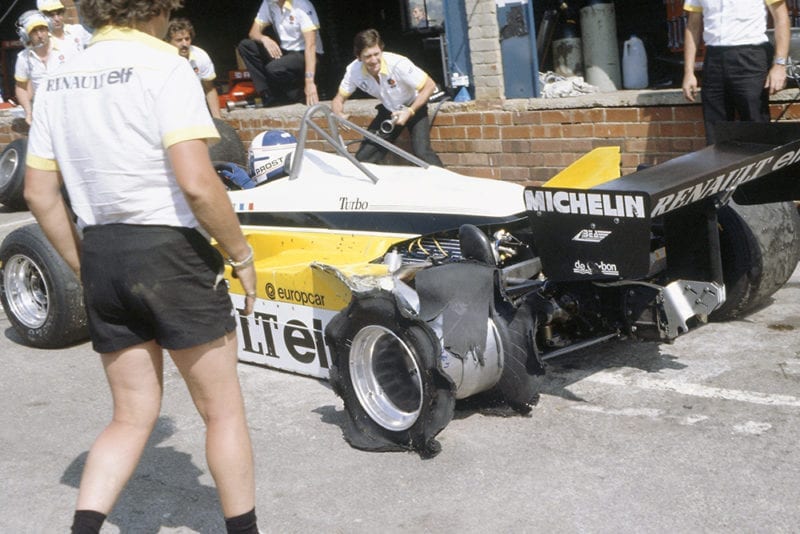 Alain Prost's Renault RE30B in the pits with a puncture.