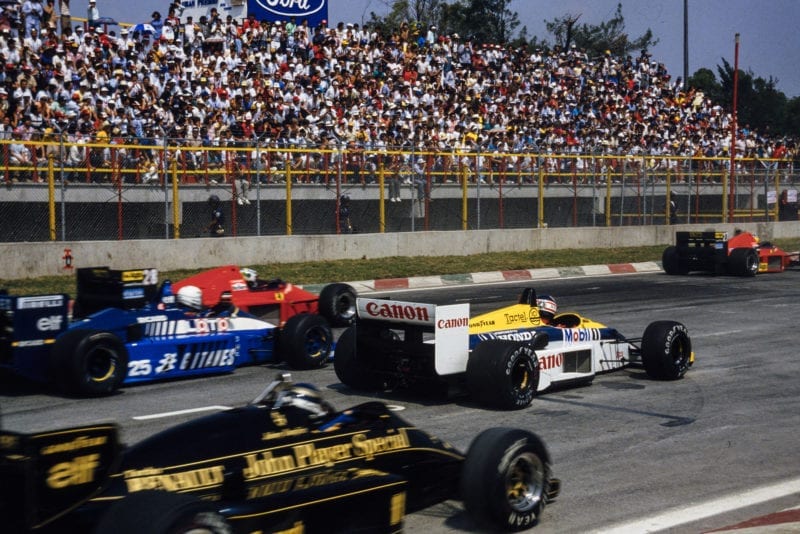 A slow-starting Nigel Mansell is passed by three cars on the grid at the 1986 Mexican Grand Prix