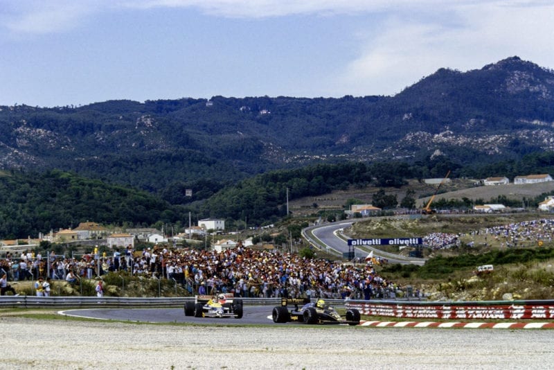 Ayrton Senna in his Lotus leads Nelson Piquet's Williams in the 1986 Portuguese Grand Prix