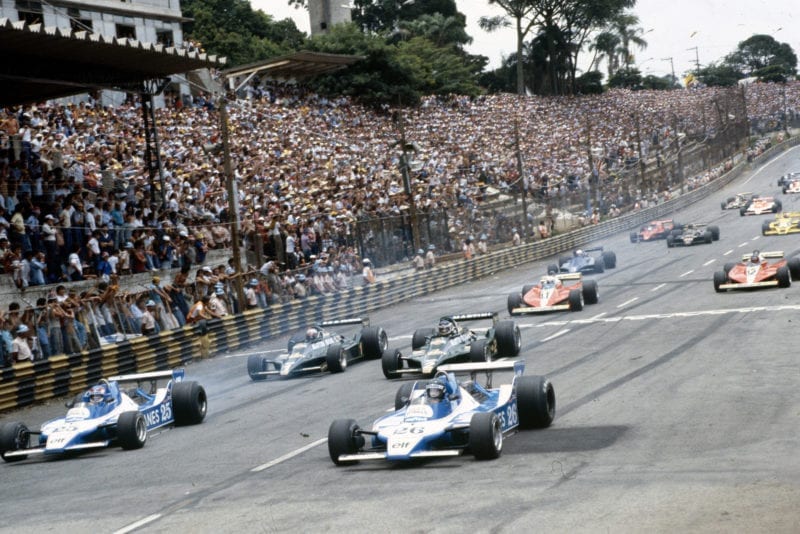 Jacques Laffite and Patrick Depailler lead away from the grid in Ligier JS11s in the 1979 Brazilian Grand Prix